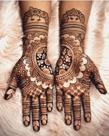 A Floral Mandal With Intricate Finger Patterns